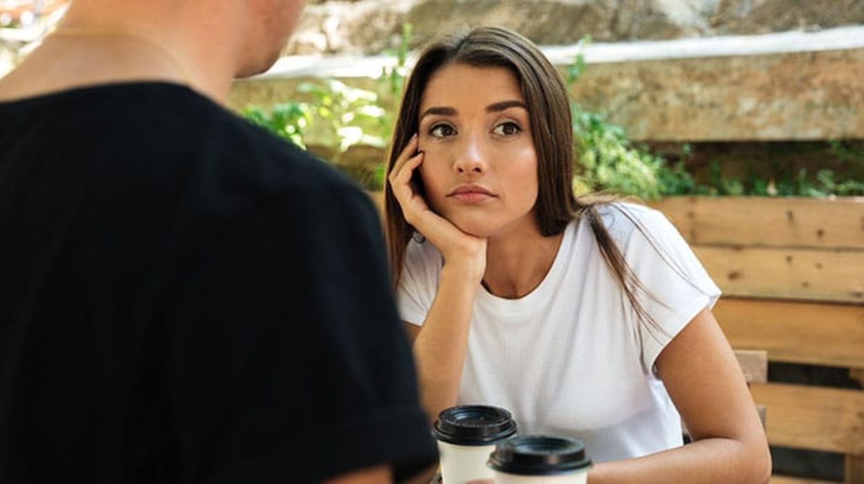 young women ignore man in café